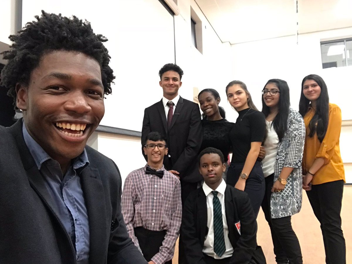 Michael Olatokun with students in Slough